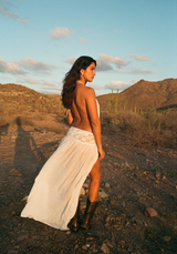 Model wearing the Loretta Dress white Lyocell maxi dress in the wild