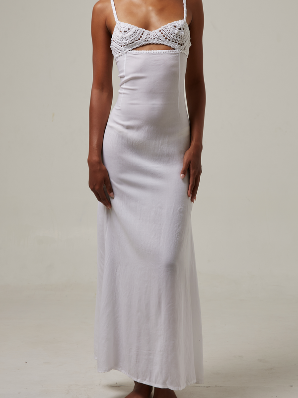 akoiaswim White slip dress with lace detailing on a plain background