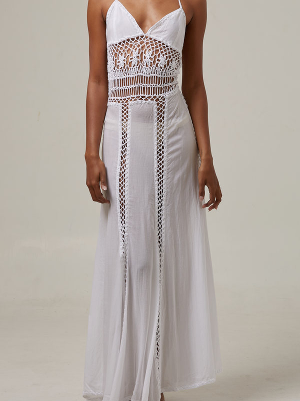 akoiaswim White dress with crochet details on a plain background